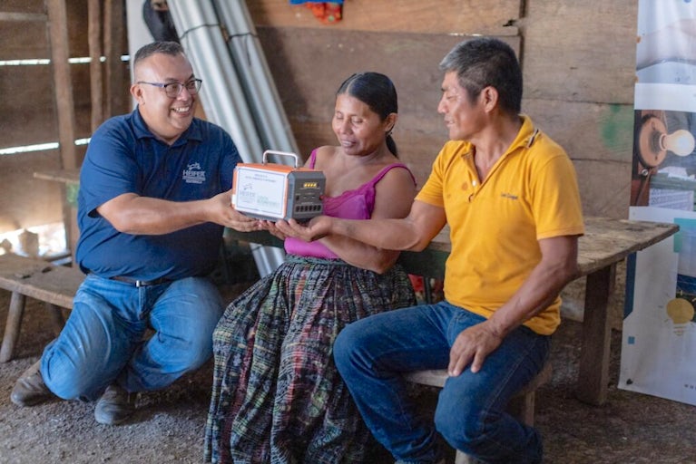 Heifer staff and farmers work together.