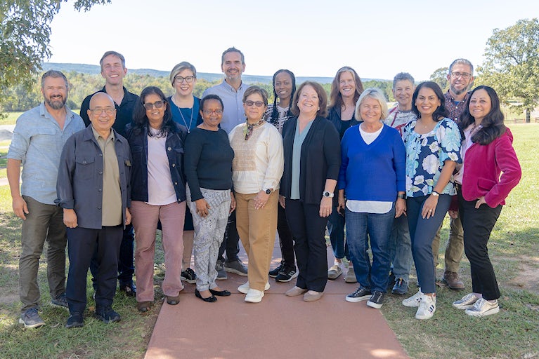 Heifer International’s board members and President and CEO, Surita Sandosham, pose for a group photo at the Heifer Ranch during their annual meeting on October 21, 2025.