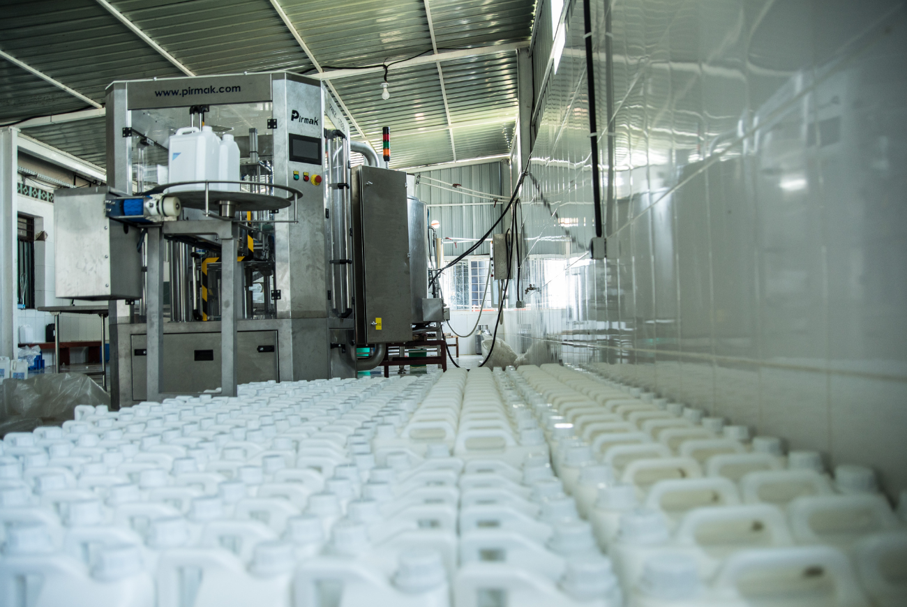 Assorted Rwandan dairy products showcased at a modern milk collection center.